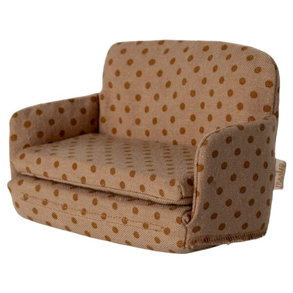 Kleines Sitzmöbel im Polka-Dot-Design, beige mit braunen Punkten, ideal für Puppenhäuser oder als Dekorationsstück.